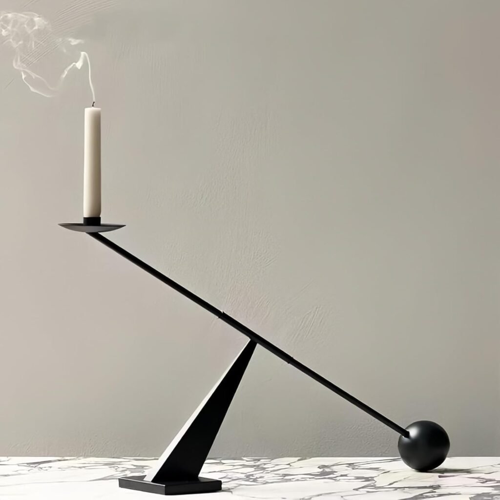 Minimalist black metal taper candle holder with geometric design