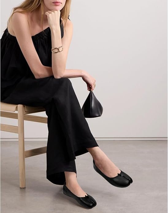 These affordable tabi shoes are soft, minimal, and surprisingly wearable. Inspired by Margiela’s iconic split-toe design, this ballet flat is a subtle way to try the look without going full hoof-mode. Style them with wide trousers, midi skirts, or a crisp oversized shirt. Quiet luxury meets everyday wear — and the price makes them an easy experiment if you’re curious about the silhouette.