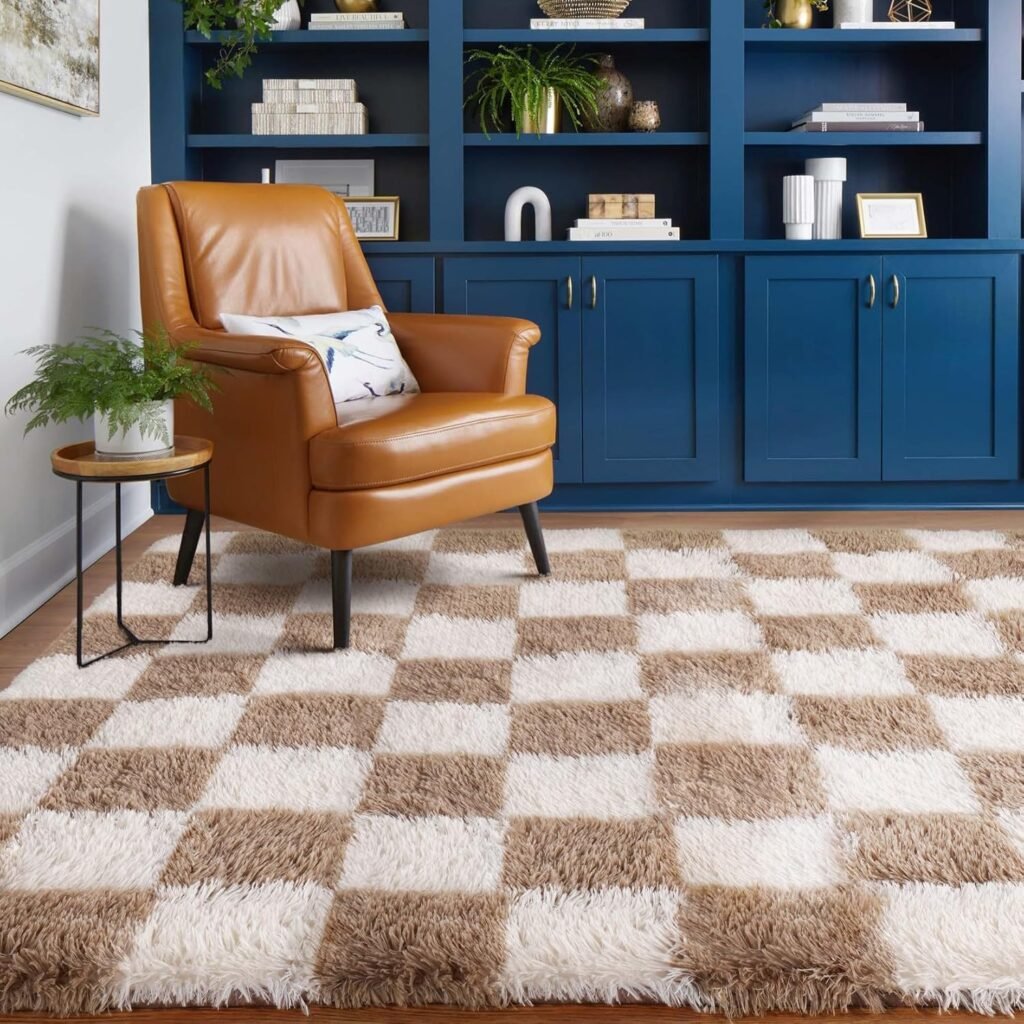 Checkerboard shag rug in tan and cream tones beneath a leather armchair in a cosy reading nook