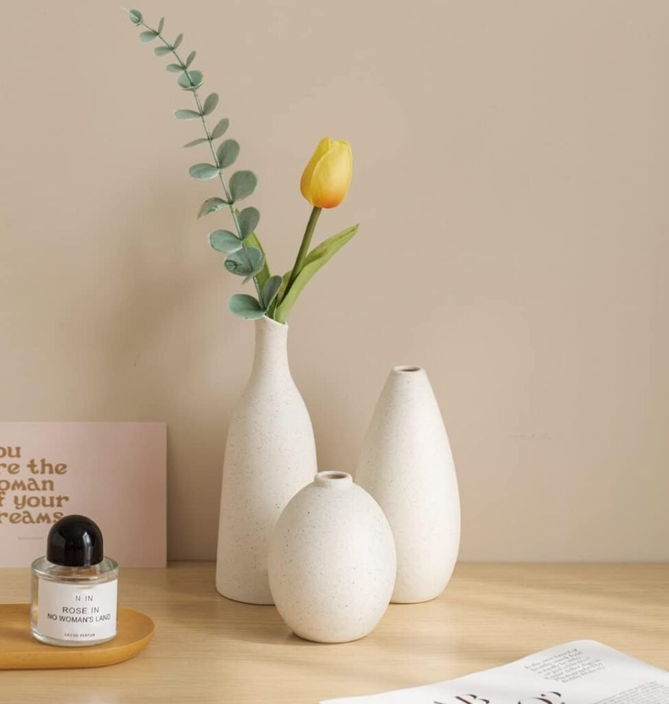 Rounded, calm, and softly speckled — these neutral vases bring subtle symmetry and texture to styled shelves or coffee tables.