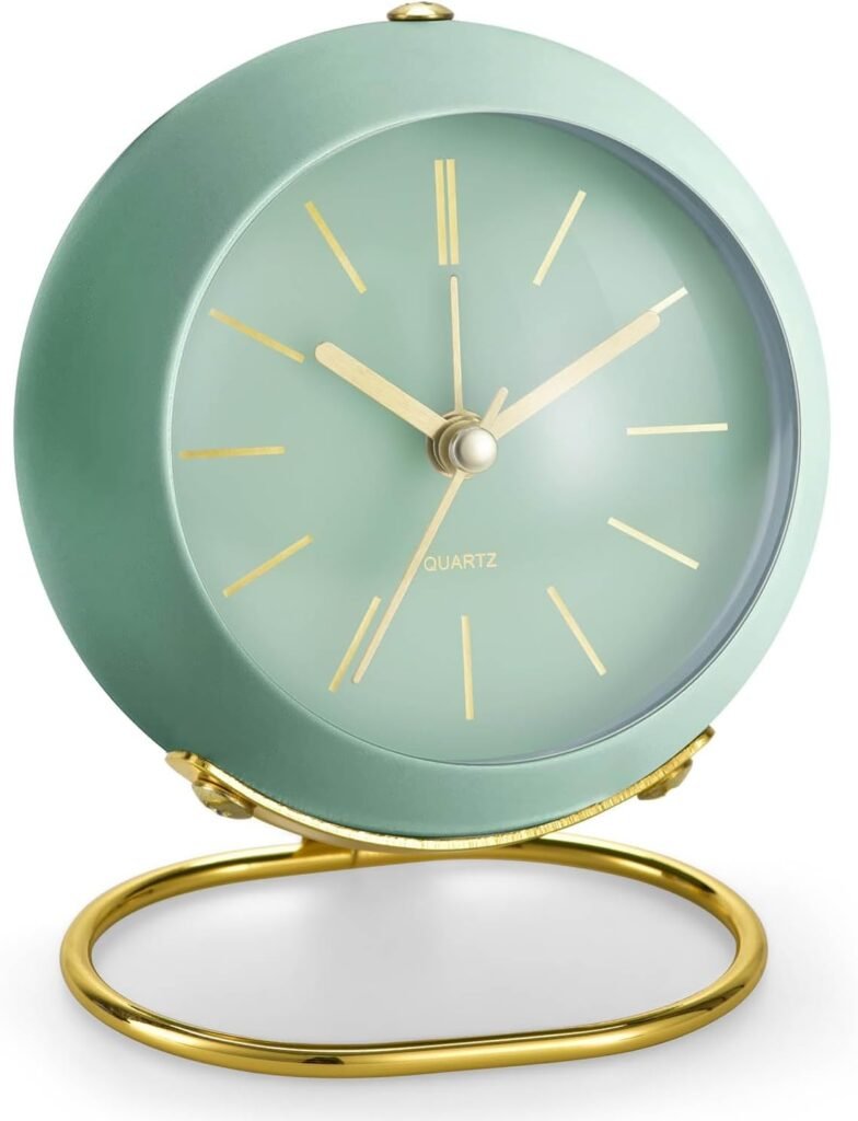 A compact mint green clock with curved edges and minimal face design