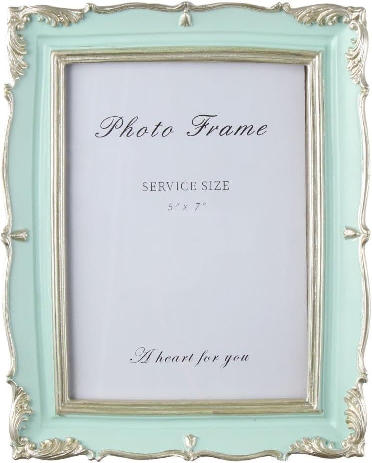 An ornate mint green and silver photo frame with vintage-style details