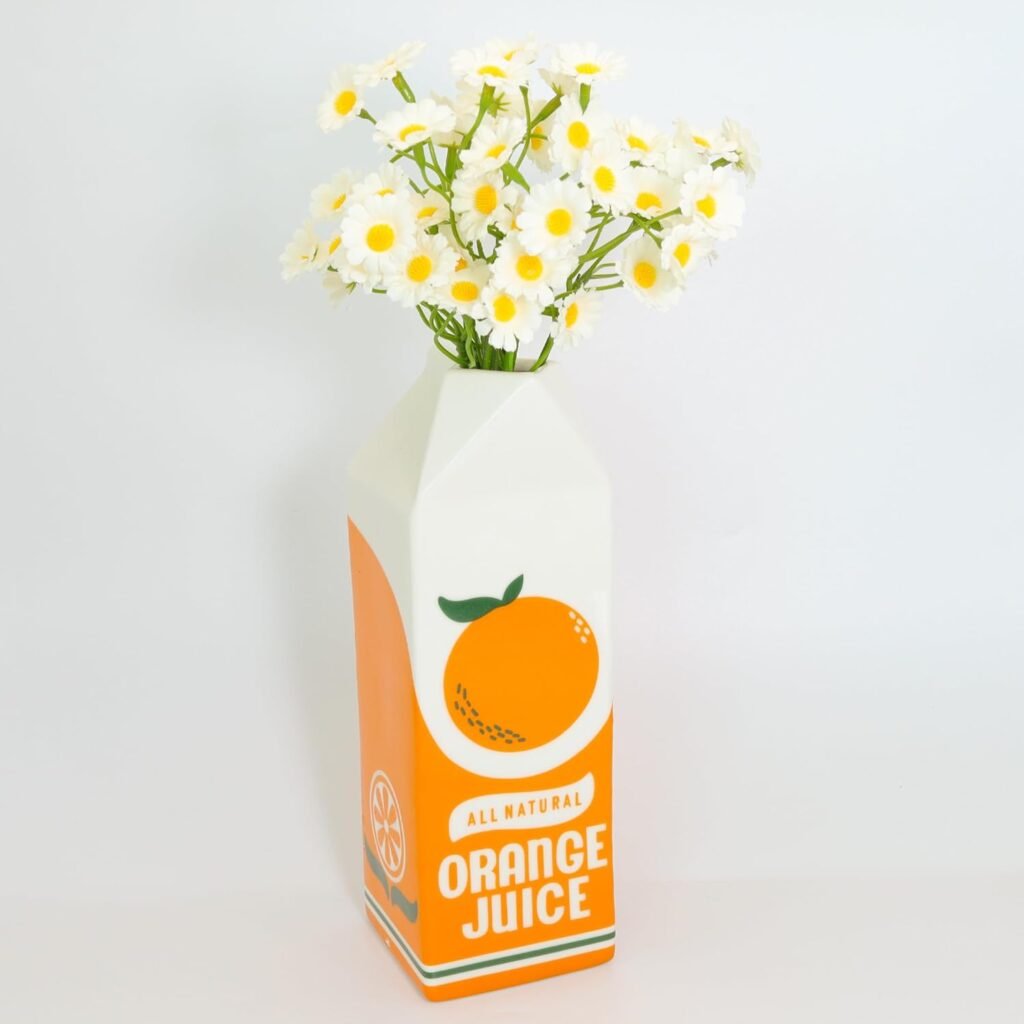 Vintage diner vibes without going full kitsch. This ceramic vase shaped like a juice carton adds colour and humour to kitchen shelves or dining areas.