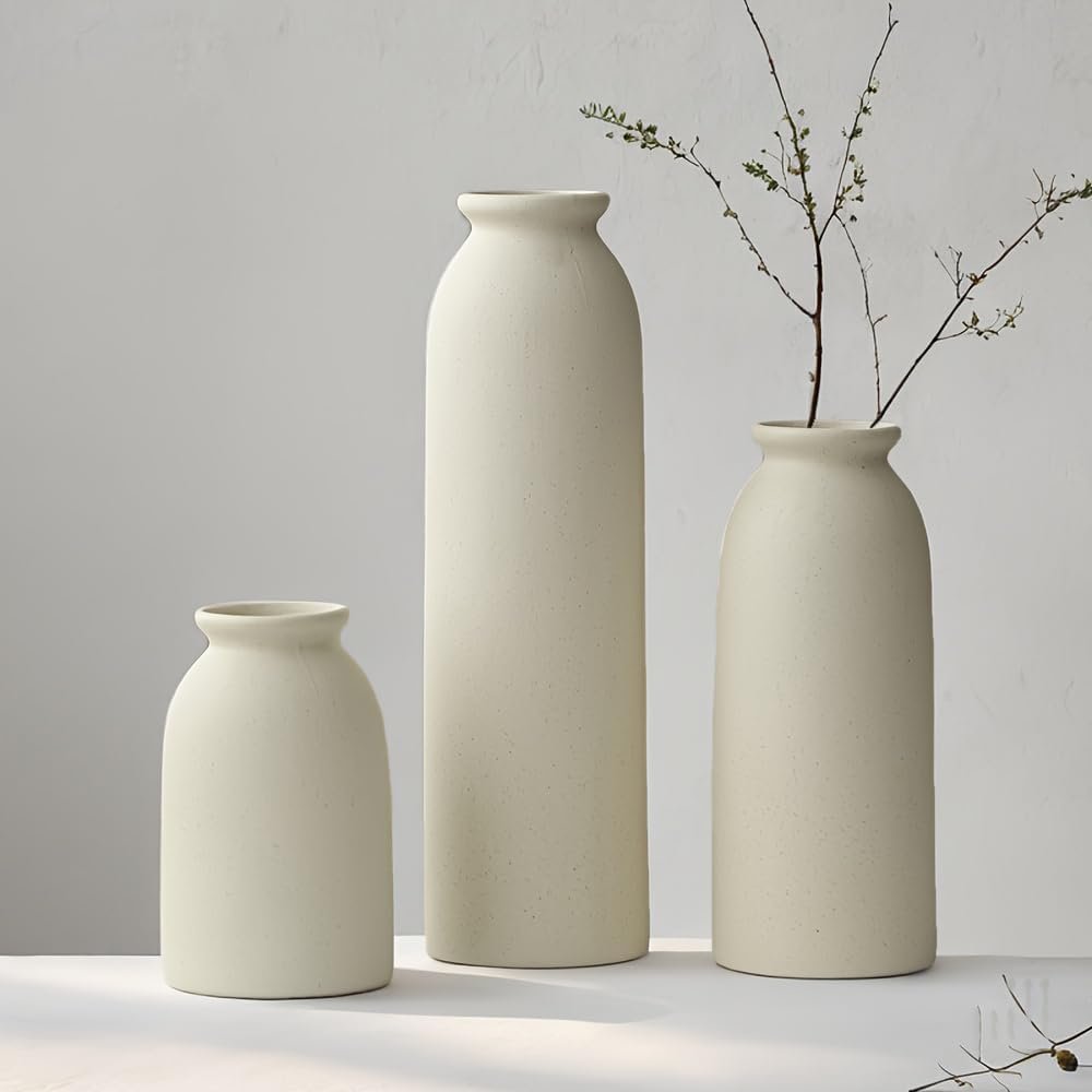 Clean lines, subtle height variation, and a calm palette — this trio of ceramic vases adds balance and structure to any shelf setup.