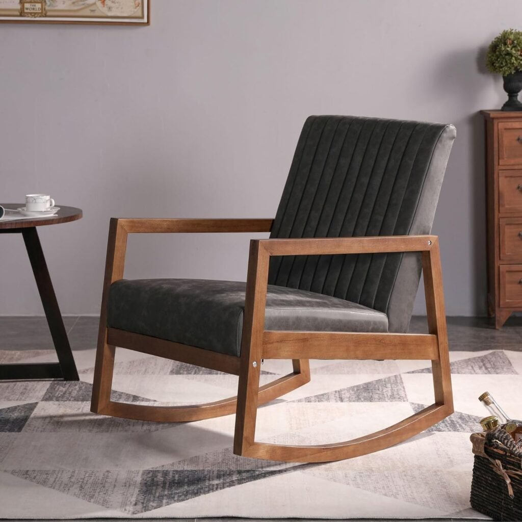 Mid-century style rocking chair with dark leather upholstery and wooden frame.