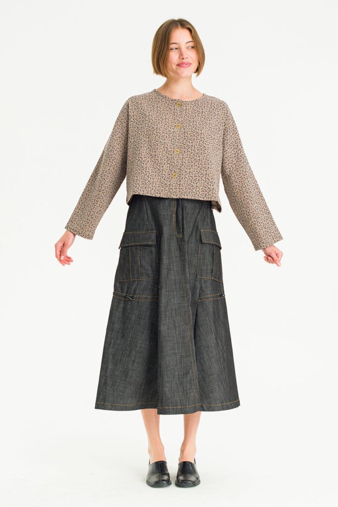 A cropped floral cardigan from Olive Clothing, worn with a long denim skirt for a vintage-inspired outfit.