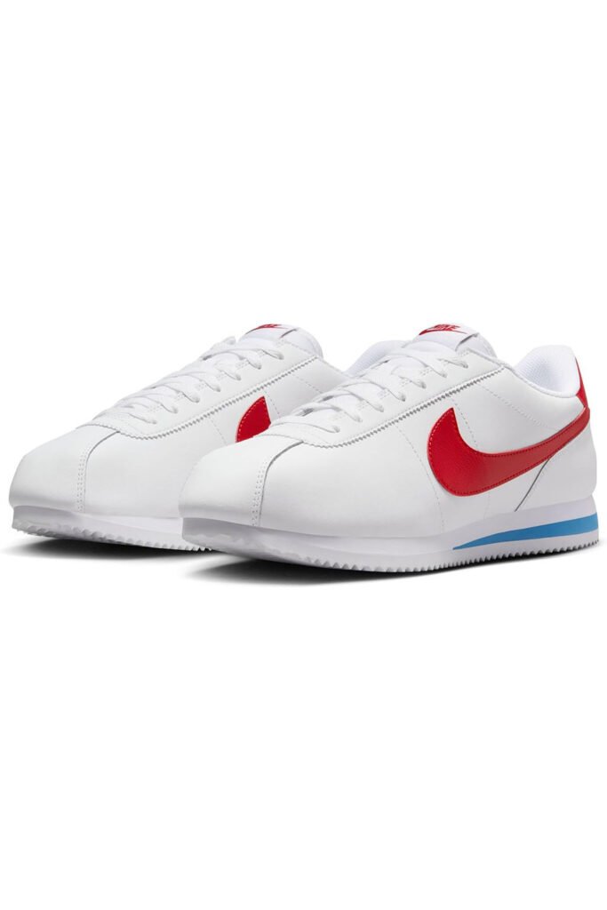 Nike Cortez sneakers in white with red swoosh and blue heel detailing