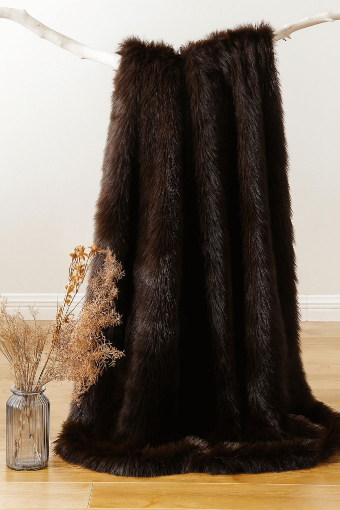 This plush brown faux fur throw blanket adds cozy texture and drama to any neutral space. A perfect accent for winter-ready rooms and warm-toned decor.