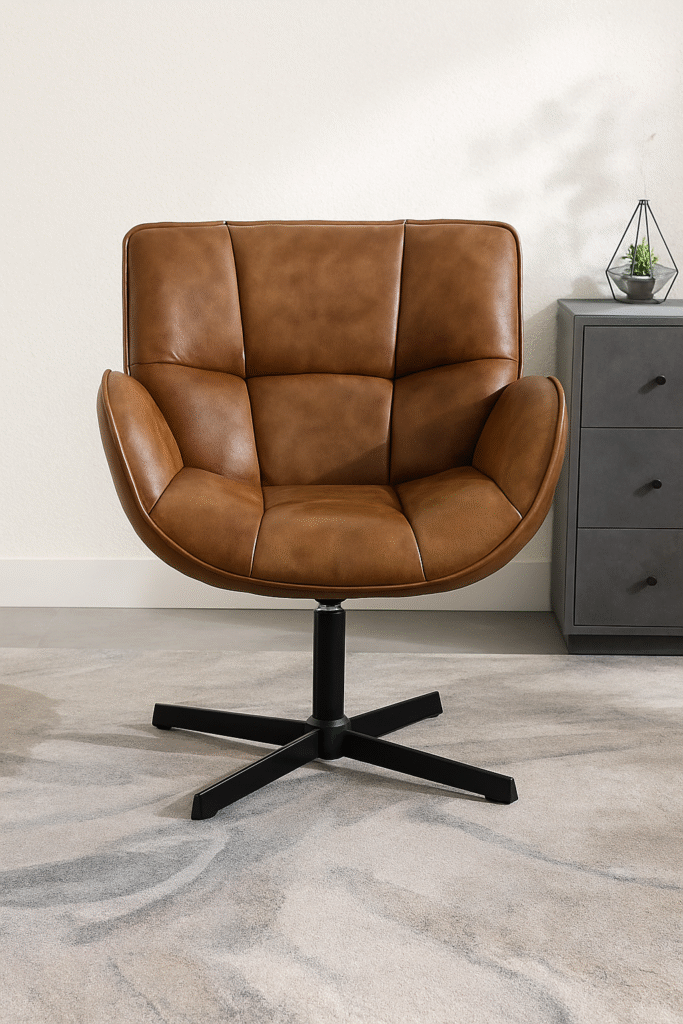 A modern leather accent chair with a smooth swivel base and rich cognac finish—perfect for bringing structure and warmth to any room.