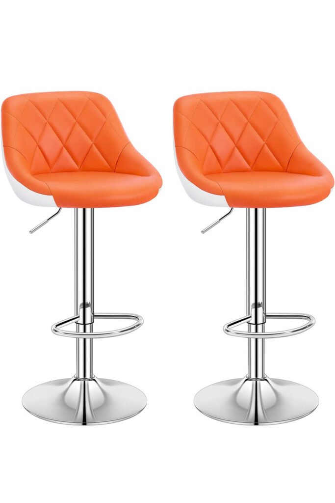 Set of two orange bar stools with quilted faux leather and chrome pedestal base