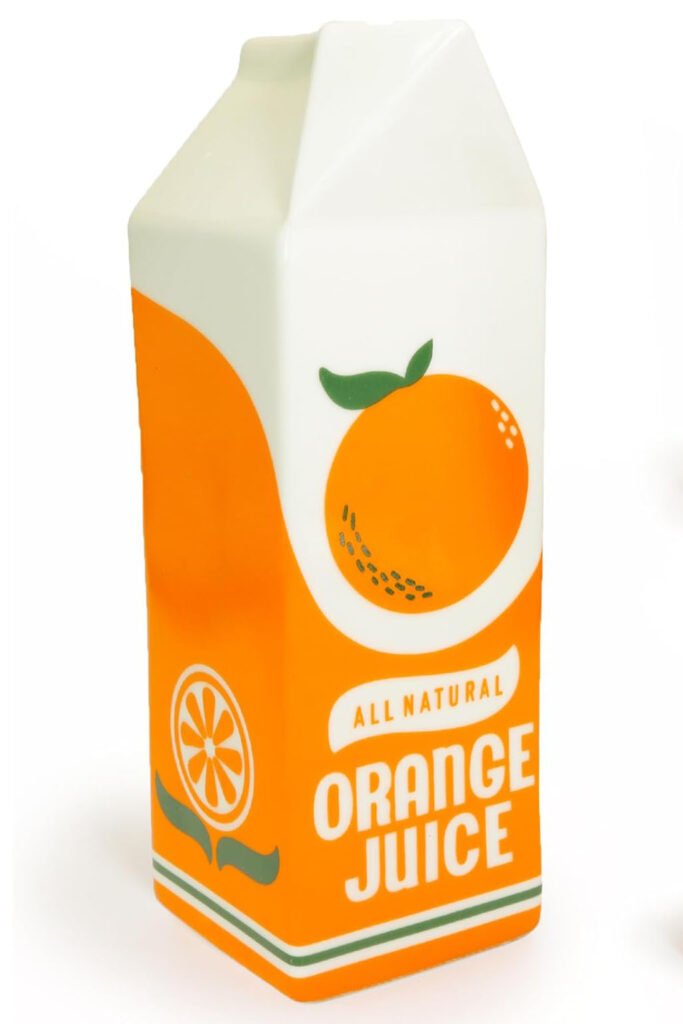 Ceramic vase shaped like an orange juice carton with bold graphic text