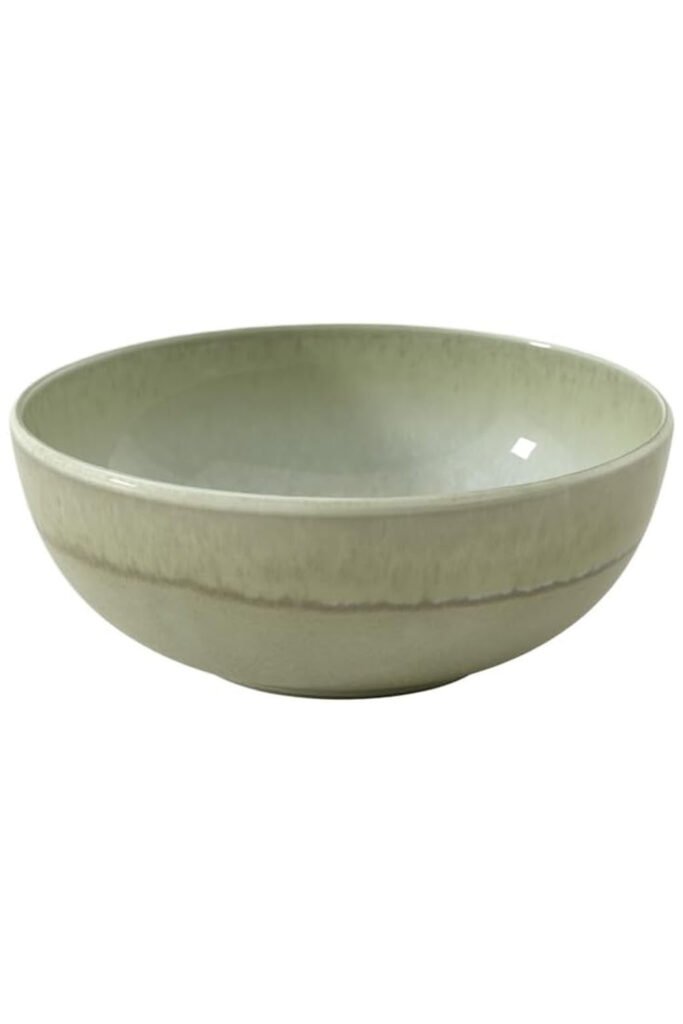 A wide sage green ceramic bowl with a soft gradient finish.