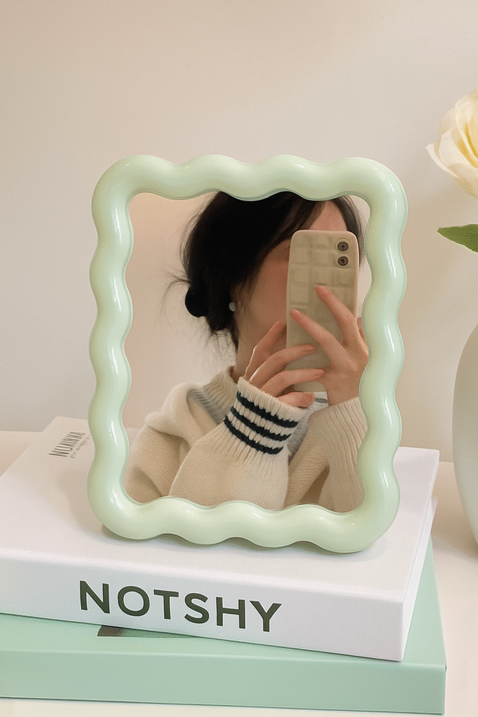 A statement mirror you’ll want to selfie with. This wavy mint green piece channels Gustaf Westman’s iconic shape — perfect for your desk, dresser, or vanity.